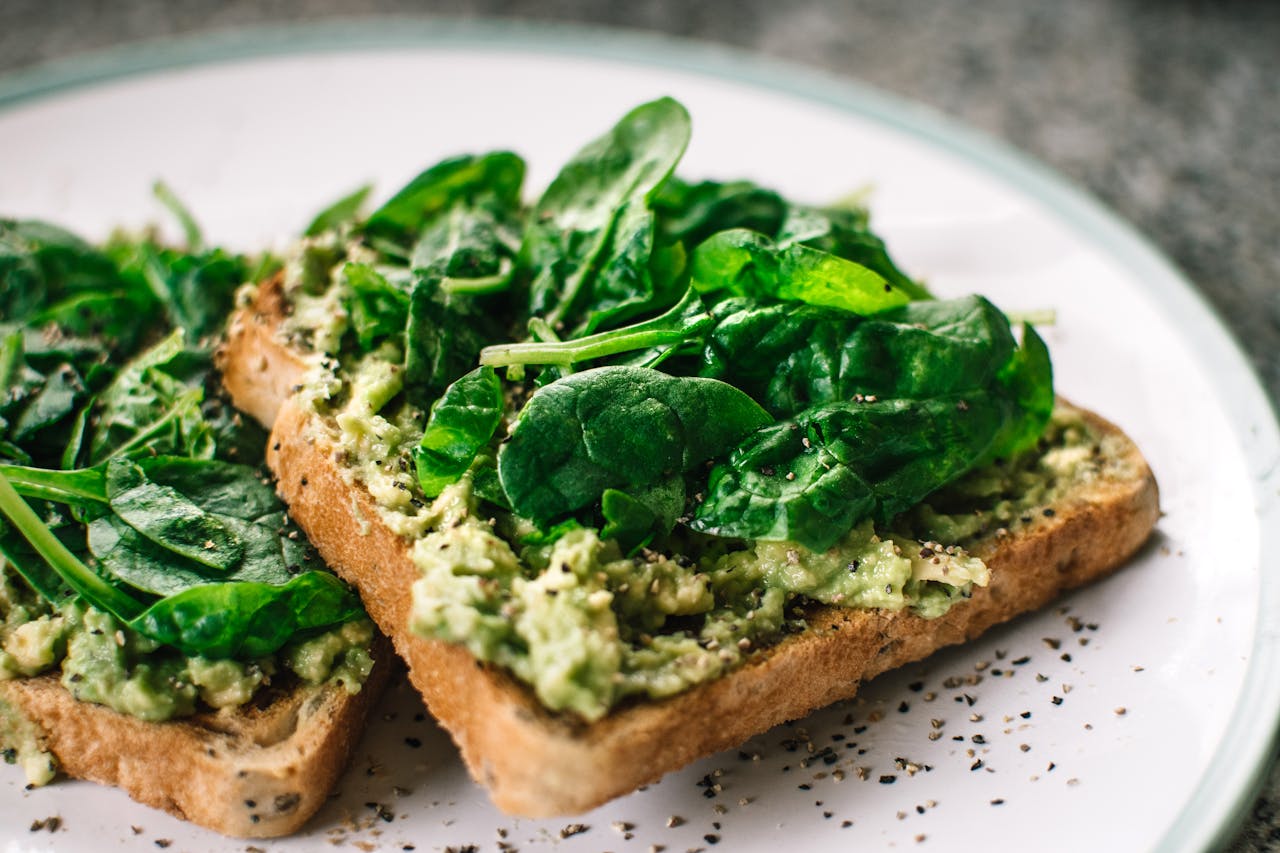 Mastering the First Impression: Your intriguing post title goes here Close-up of a homemade avocado and spinach sandwich on whole grain toast.